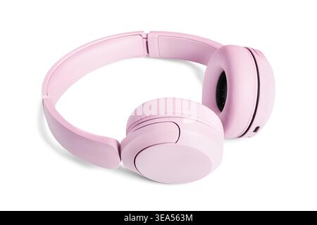 Pink wireless headphones lying on white background Stock Photo