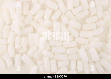 Styrofoam packing peanuts  background. White plastic foam pellets protective for parcel packing. Stock Photo