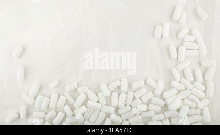 Styrofoam packing peanuts  background. White plastic foam pellets protective for parcel packing. Stock Photo