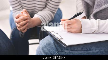 Group Discussion Takes Place During a Session With Participants Engaged in Dialogue and Note-Taking Stock Photo