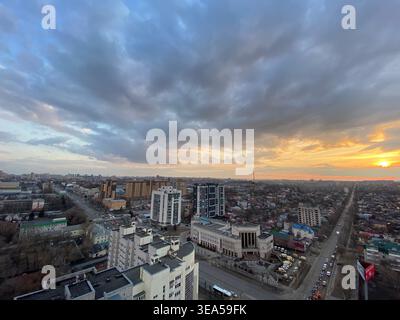 Voronezh, Russia - March 28 2021: Panoramic urban skyline under dramatic sunset clouds with wide cityscape horizon Stock Photo