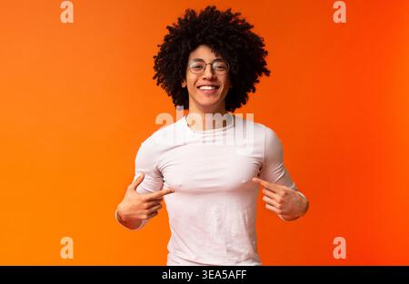 Self-assured and charismatic black guy promoting himself Stock Photo