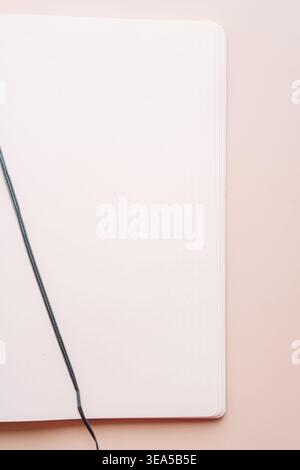 Blank notebook with ribbon bookmark on beige background Stock Photo