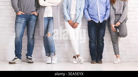 Legs of diverse people standing in row Stock Photo