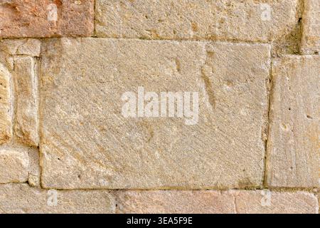 Light beige stone wall texture with rectangular masonry blocks for background Stock Photo