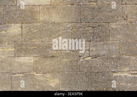 Light brown stone wall texture with rectangular masonry blocks for background Stock Photo
