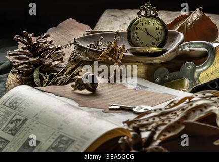 A rich tableau of nostalgia and tactile beauty, this collection of curiosities brings together fragments of a forgotten era. The prominent golden pock Stock Photo
