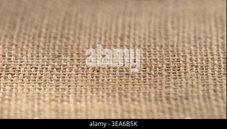 Woven fabric on a flat surface showing texture and natural fibers in a workshop setting during the daytime Stock Photo