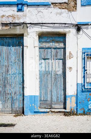Old vintage door. facade of Portuguese house, Olhao, Algarve, Portugal. Stock Photo