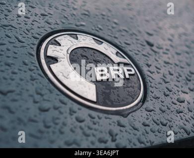 Chemal, Russia - August 20, 2021: BRP logo on a dark vehicle surface covered in fresh raindrops during an overcast day Stock Photo