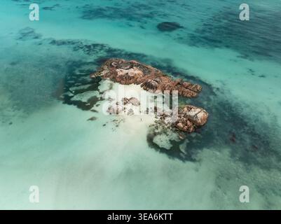 Aerial view of the white sandbar surrounded by turquoise water with ...