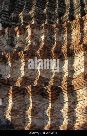 Close view of ancient brick wall at wat ayutthaya thailand temple ruin showing rich history and peaceful feeling under bright warm sunlight casting de Stock Photo
