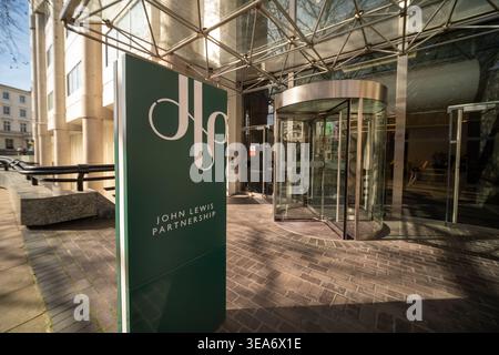 LONDON - MAY 02, 2026:  Westminster – John Lewis Partnership headquarters modern entrance with revolving doors. Stock Photo