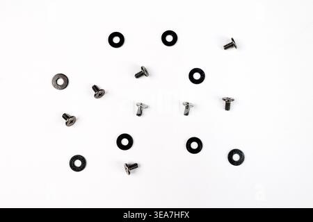 6mm Small Screws with black washers isolated on a White Background. These mounting screws are used to build desktop computer or electronics (Top View) Stock Photo