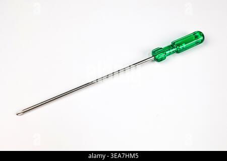 A Long size Four-head or Cross-head Screwdriver isolated on a white background (Used to Repair daily Life Electronic or Mechanical items) Stock Photo