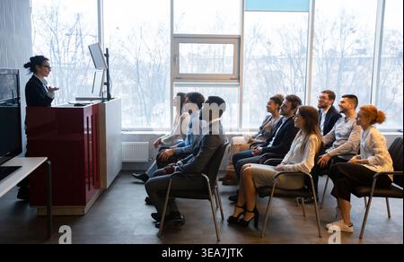 Corporate training concept. Business coach giving presentation Stock Photo