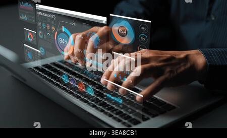 Hands Typing on Laptop with Virtual Data Analytics Dashboard Displaying Charts and Metrics for Business Intelligence and Performance Evaluation Stock Photo