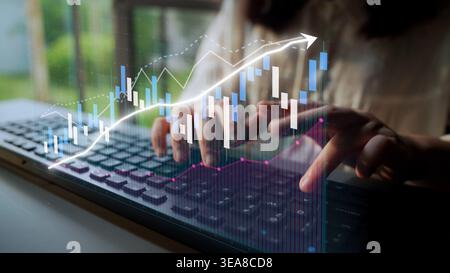 A business person engages with a laptop, utilizing data analysis tools and visual graphics to monitor financial trends and growth opportunities in a Stock Photo