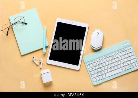 Composition with different modern gadgets and stationery on beige background Stock Photo