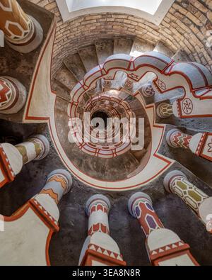 Looking down into the decorative spiral staircase inside the tower of Bory Castle in Szekesfehervar, Hungary. Stock Photo