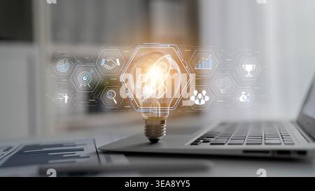Creative Concept Showing Light Bulb and Digital Interface Representing Innovation, Business Growth, and Technology on Laptop Keyboard Sigmoid Stock Photo