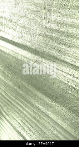 Shadow of a blind on a white wall. Diagonal striped shadows on a white stone wall. Light and shadows falling on color wall. Stock Photo