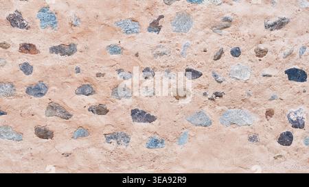 Ancient Stone and Mud Wall Texture of Fujairah Fort, UAE Stock Photo
