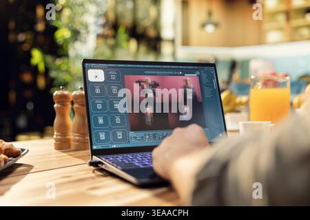 Male freelancer uses generative AI software and chatbot tools, text-to-image generation with artificial intelligence algorithms on laptop. Smart technology and autonomous assistance remotely. Stock Photo