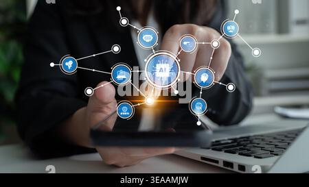 A professional person using a smartphone to engage with artificial intelligence icons, highlighting the intersection of technology and modern business Stock Photo