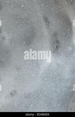 Soap suds create an organic, textured background that resembles a nebula scene from outer space. Stock Photo