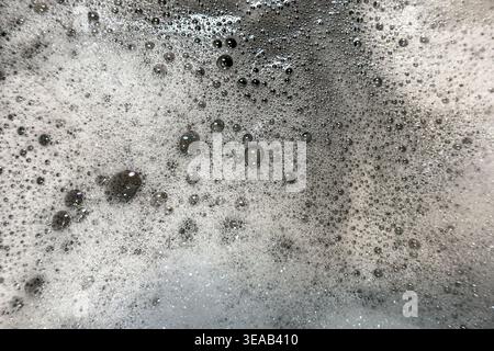 Soap suds bubbles and foam create an organic, textured background element. Stock Photo