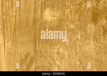 High-resolution texture of an old yellow cement wall with scratches, stains, and weathered details. Perfect for industrial designs, vintage background Stock Photo
