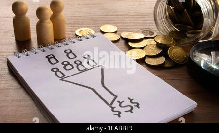 A hand-drawn sketch of a sales funnel on a notepad, showing potential customers being converted into revenue, surrounded by wooden figures and coins. Stock Photo