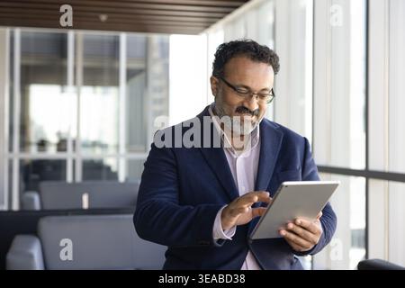 Business professional using tablet for digital workflow Stock Photo