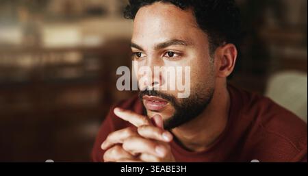 Thinking, relax and calm with man on sofa in home for reflection, planning and inspiration. Vision, mindfulness and perspective with male person in Stock Photo