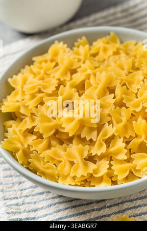 Organic Mini Farfalle Bow Tie Pasta in a Bowl Stock Photo