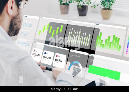 Business chart displayed on computer screen while a man analyzes data in digital setting Stock Photo