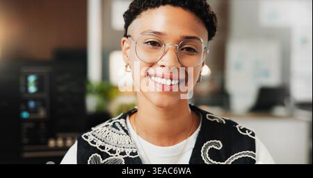 Portrait, programmer and woman in office, smile and software development for website launch. Employee, professional and person in workplace, coding Stock Photo