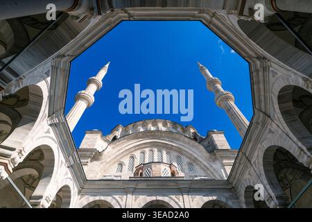 Dramatic Low-Angle View of Nuruosmaniye Mosque Minarets Against a Clear Blue Sky, Istanbul, Turkey Stock Photo