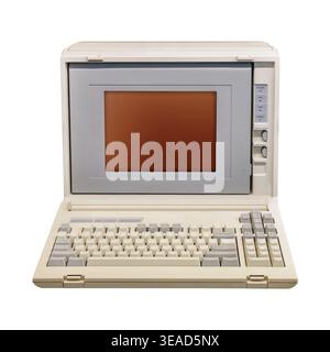 Vintage eighties portable desktop computer with amber crt display isolated on a white background Stock Photo