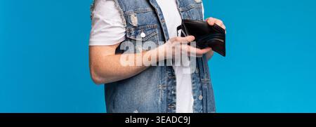 Cropped photo of empty wallet in man hands Stock Photo