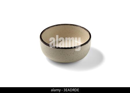 Empty ceramic beige bowl isolated on white background. Food display mockup. Stock Photo