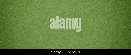 Lime green suede fabric background with matte microfiber texture, soft felt olive surface with vignette in macro. Stock Photo