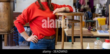 Female Carpenter Standing in her Workshop Stock Photo