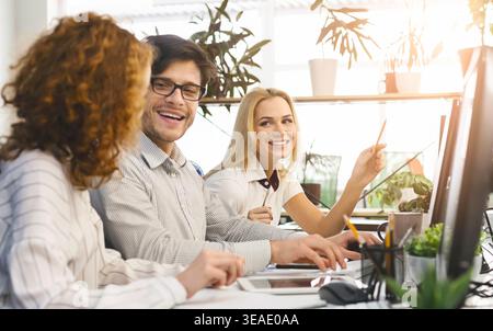 Colleagues Engaged in a Collaborative Meeting in a Bright Office Space During the Afternoon Stock Photo