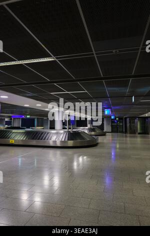 Empty airport baggage carousel in terminal, travel arrival concept. Stock Photo