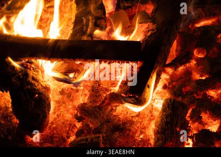 Close-up of Logs Burning with Intense Yellow and Orange Flames. Stock Photo