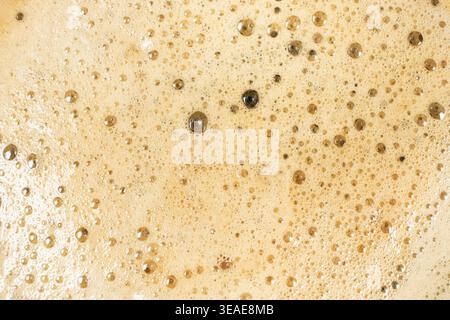Brown and gold coffee bubbles texture for culinary background. Stock Photo