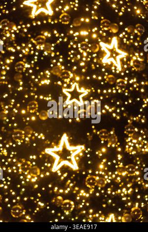Abstract Christmas Background with Blurred Golden Bokeh Lights Stock Photo