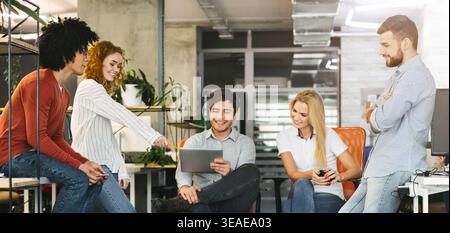 Group of Young Professionals Collaborating in a Modern Office Environment During Daytime Stock Photo